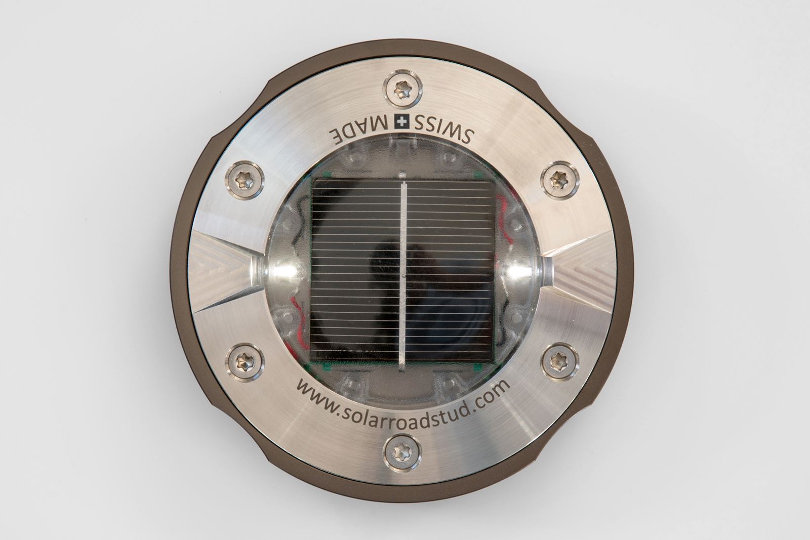 solar road stud ultra flat installed in the road surface to withstand heavy snowplough equipment